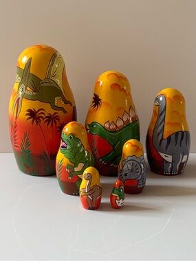 ⁠7pc Dinosaur Dino Nesting Dolls Matryoshka Wood Painted T-Rex Stegosaurus Decor
